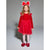 A young girl modeling a festive red holiday costume dress with long sleeves, a sparkly tulle skirt, matching red bow headband, and red bow shoes against a neutral gray studio background.
