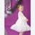 A young girl with blonde hair tied back in a bow wears a white tulle party dress with sheer long sleeves, posing against a vibrant purple background with silver tinsel and disco ball decorations.