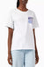 Person wearing a white t-shirt with a small graphic on the chest against a plain background