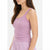 A woman wearing a light purple ribbed tank top with scalloped lace trim along the neckline and arm straps, paired with matching light purple pajama pants, shown against a plain white background.