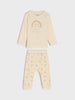 Children's pajama set with rainbow design on a white background