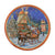 Decorative round plate with festive design on a tiled floor.