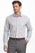 Man wearing a light gray dress shirt and gray pants on a white background