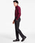 Man wearing a red patterned shirt and black pants on a white background