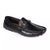 A black leather penny loafer driving shoe with a decorative strap and silver-tone buckle, shown from a three-quarters angle on a white background.