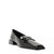 A single black leather penny loafer with a pointed toe and low block heel, shown from a side profile on a white background.