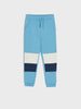 Blue and white jogger pants on a light gray background