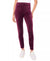 Purple pants worn by a person on a white background