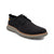 A black lace-up casual shoe with a textured upper, black laces, a small tan accent tab on the heel, and a thick gray sole with a tan edge, shown on a white background.