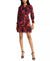 Woman wearing a colorful floral dress on a white background
