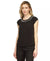 Woman wearing a black sleeveless top with embellished neckline on a white background