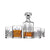 A crystal decanter with a stopper and four matching cut-glass whiskey tumblers, including one filled with amber liquor, photographed on a clean white background.