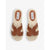 Pair of Steve Madden sandals with woven design and brown leather straps on a white background