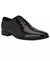 Black patent leather dress shoe on a white background