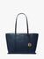 Navy blue handbag with gold logo on a white background