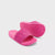 A pair of bright pink slide sandals with textured wavy straps and a raised wavy sole, shown on a light gray background.