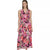 A woman modeling a sleeveless midi wrap dress with a vibrant pink, red, and purple floral print on a light background, paired with nude heels, set against a plain white studio background.