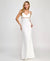 Woman wearing a white evening gown with gold accents on a plain background