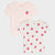 Two children's short-sleeve ruffle-edge T-shirts laid flat on a light gray background. The top shirt is pale pink with a small strawberry graphic on the chest.