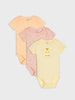 Three baby bodysuits in peach, pink, and yellow on a light gray background
