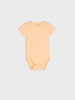 Plain peach baby onesie on a light gray background