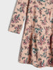 Floral dress with pink and green pattern on a light background