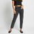 A model wearing a pair of dark gray high-waisted straight-leg jeans, styled with a black crop top and black flats, standing against a light gray studio background.