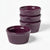 Set of purple ceramic ramekins on a white background