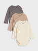Three baby bodysuits in gray, beige, and cream on a light gray background