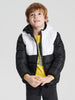 Child wearing a black and white jacket on a light gray background