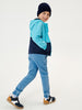Child wearing a blue and navy outfit with a beanie on a white background