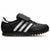 Black and white athletic shoe with cleats on a white background