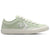 Light green sneaker with white star logo on a white background