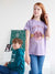 Two children wearing clothing with graphic designs on a white background