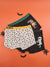 Three pairs of Halloween-themed boxer briefs on an orange background with decorative elements.