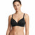 A woman modeling a black wireless bra with thin shoulder straps and a small gold button at the center, photographed against a plain white studio background.