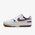 White sneaker with red and blue accents on a white background