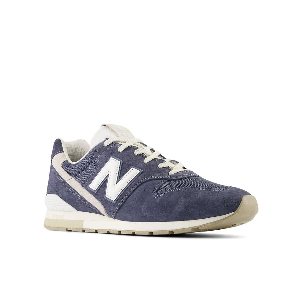 Navy blue sneaker with white accents on a white background