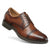 A brown leather cap-toe oxford shoe with dark brown laces and a dark sole, shown from a three-quarters angle on a white background.