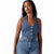 A woman modeling a sleeveless blue denim jumpsuit with a button-front bodice and high-waisted fit, photographed against a plain white studio background.