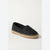 A single black woven slip-on espadrille shoe with a natural jute-wrapped platform sole, shown from a three-quarters angle on a light off-white background.