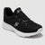 Black sneaker with white sole on a light gray background