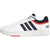 A white Adidas low-top sneaker with navy blue three-stripes, a navy collar, and a bright orange-red accent line and detail on the midsole.