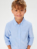 Young boy wearing a light blue shirt against a white background