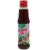 A bottle of Benina Sesame Oil with a label showing the brand name and the product name, alongside an image of sesame seeds and a dish using the oil.