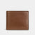 A brown pebbled leather bifold wallet with a debossed COACH logo on the bottom right, shown against a plain light gray background.