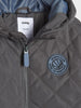 Quilted jacket with a visible brand label and logo on a white background