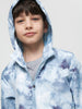 Child wearing a blue tie-dye hoodie against a plain background