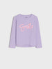 Purple long-sleeve shirt with 'smile' text in pink on a white background