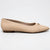 A single beige pointed-toe flat shoe with a small gold decorative accent on the vamp, shown in profile against a plain white background.